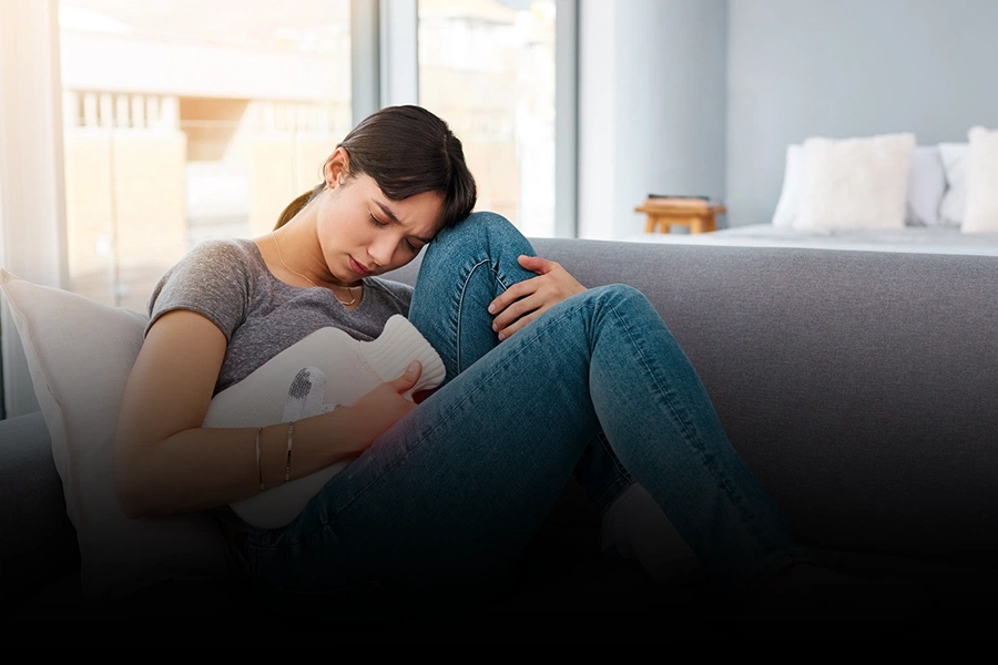 woman having pelvic pain and menstrual discomfort. Learn Can PCOS cause infertility in women