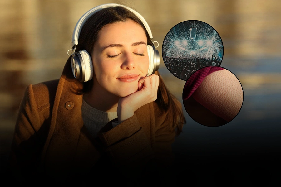 Woman experiencing chills and goosebumps while listening to music with headphones