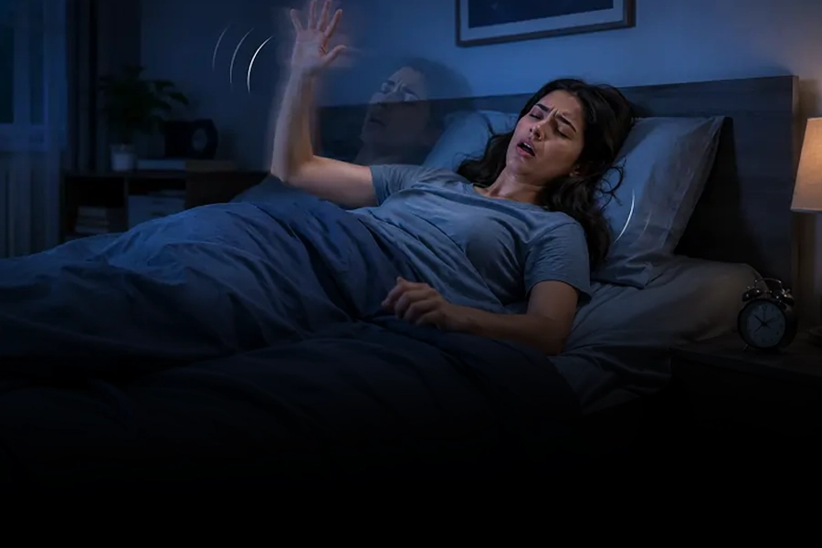 Woman experiencing a sudden hypnic jerk while falling asleep in bed